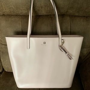 Pale pink Kate Spade handbag.
